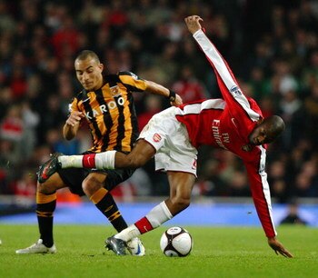 LONDON - MARCH 17:  Craig Fagan of Hull City challenges Vassiriki Diaby of Arsenal during the the FA Cup Sponsored by E.on sixth round match between Arsenal and Hull City at Emirates Stadium on March 17, 2009 in London, England.  (Photo by Ryan Pierse/Get