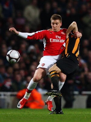 LONDON - MARCH 17:  Nicklas Bendtner of Arsenal challenges Ian Ashbee of Hull City during the the FA Cup Sponsored by E.on sixth round match between Arsenal and Hull City at Emirates Stadium on March 17, 2009 in London, England.  (Photo by Ryan Pierse/Get