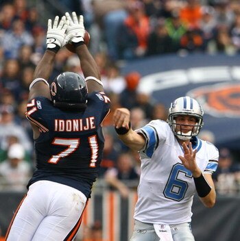 CHICAGO - NOVEMBER 02:  Lineman Israel Idonije #71 of the Chicago Bears blocks a pass from quarterback Dan Orlovsky #6 of the Detroit Lions during the fourth quarter at Soldier Field on November 2, 2008 in Chicago, Illinois. The Bears defeated the Lions 2