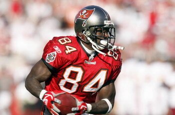 TAMPA - NOVEMBER 19: Joey Galloway #84 of the Tampa Bay Buccaneers carries the ball during the game against  the Washington Redskins on November 19, 2006 at Raymond James Stadium in Tampa, Florida. (Photo by Matt Stroshane/Getty Images)