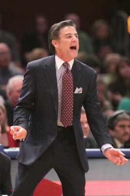 NEW YORK - MARCH 14:  Head coach Rick Pitino of the Louisville Cardinals yells to his players against the Syracuse Orange during the championship game of the Big East Tournament at Madison Square Garden on March 14, 2009 in New York City. (Photo by: Micha
