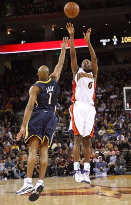 OAKLAND, CA - JANUARY 11: Jamal Crawford #6 of the Golden State Warriors shoots over Jarrett Jack #1 of the Indiana Pacers during an NBA game on January 11, 2009 at Oracle Arena in Oakland, California. NOTE TO USER: User expressly acknowledges and agrees 