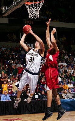 SPOKANE, WA - MARCH 16:  Rob Kurz #31 of Notre Dame drives to the basket against Philip Williams #33 of Winthrop during the first round of the NCAA Men's Basketball Tournament at Spokane Memorial Arena March 16, 2007 in Spokane, Washington.  (Photo by Jon