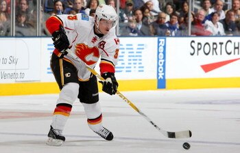TORONTO - MARCH 14:  Dion Phaneuf #3 of the Calgary Flames makes a pass against the Toronto Maple Leafs during their NHL game at the Air Canada Centre March 14, 2009 in Toronto, Ontario.(Photo By Dave Sandford/Getty Images)