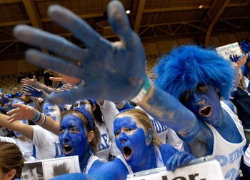 DURHAM, NC - FEBRUARY 07:  Fans cheer as they wait for the start of a game between the Duke Blue Devils and the North Carolina Tar Heels on February 7, 2007 at Cameron Indoor Stadium in Durham, North Carolina.  (Photo by Grant Halverson/Getty Images)