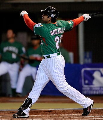MEXICO CITY - MARCH 09:  Adrian Gonzalez #23 of Mexico watches his  two-run home run against South Africa during the first inning of the 2009 World Baseball Classic Pool B game on March 9, 2009 at the Estadio Foro Sol in Mexico City, Mexico.  (Photo by Ke