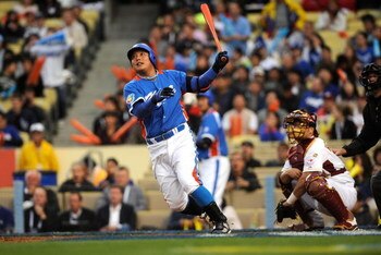 LOS ANGELES, CA - MARCH 21: Tae Kyun Kim #52 of Korea hits a two-run homerun in the second inning of the semifinal game of the 2009 World Baseball Classic against Venezuela on March 21, 2009 at Dodger Stadium in Los Angeles, California. (Photo by Kevork D