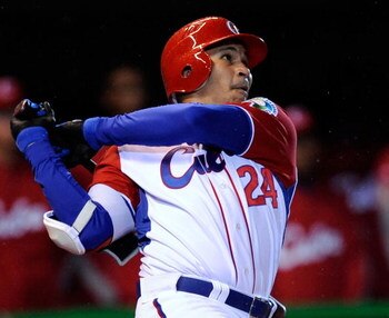 MEXICO CITY - MARCH 12:  Frederich Cepeda #24 of Cuba hits a three-run home run to end the game early on the mercy rule, 16-4, against Mexico during the 2009 World Baseball Celassic Pool B match on March 12, 2009 at the Estadio Foro Sol in Mexico City, Me