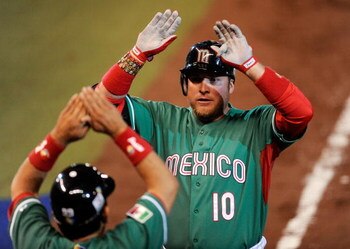 MEXICO CITY - MARCH 12:  Karim Garcia #10 of Mexico is congratulated after hitting a one-run home run against Cuba during the 2009 World Baseball Classic Pool B match on March 12, 2009 at the Estadio Foro Sol in Mexico City, Mexico.  Cuba won, 16-4. (Phot
