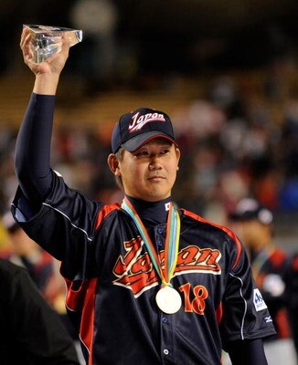 LOS ANGELES, CA - MARCH 23:  Daisuke Matsuzaka #18 of Japan holds up the the MVP trophy after defeating Korea during the finals of the 2009 World Baseball Classic on March 23, 2009 at Dodger Stadium in Los Angeles, California. Japan won 5-3 in 10 innings.