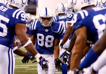 INDIANAPOLIS - DECEMBER 28:  Marvin Harrison #88 of the Indianapolis Colts is greeted by teammates during player introductions prior to the first half of the game against the Tennessee Titans at Lucas Oil Stadium December 28, 2008 in Indianapolis, Indiana