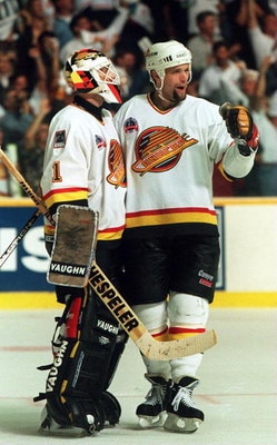 11 JUN 1994: CANUCKS DEFENSEMAN BRENT HEDIGAN CELEBRATES WITH GOALTENDER KIRK MCLEAN AFTER DEFEATING THE RANGERS, 4-1, IN GAME SIX OF THE STANLEY CUP FINALS IN VANCOUVER, BRITISH COLUMBIA. THE WIN TIES THE SERIES AT 3-3. GAME SEVEN WILL BE PLAYED IN NEW Y