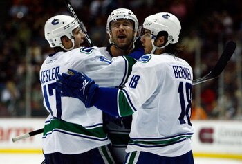 ANAHEIM, CA - OCTOBER 31:  (L-R) Ryan Kesler #17, Mattias Ohlund #2, and Steve Bernier #18 of the Vancouver Canucks celebrate Ohlund's goal in the second period against the Anaheim Ducks looks at the Honda Center on October 31, 2008 in Anaheim, California