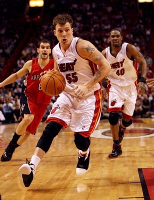 MIAMI - APRIL 03:  Jason Williams #55 of the Miami Heat drives to the basket after getting past Jose Calderon #8 of the Toronto Raptors at American Airlines Arena on April 3,  2007 in Miami, Florida. The Heat defeated the Raptors 92-89. NOTE TO USER: User