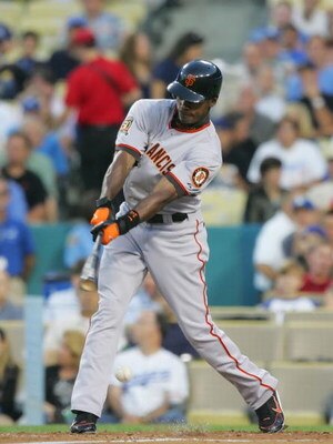 LOS ANGELES - JULY 28:   Fred Lewis #14 of the San Francisco Giants hits a sacrifice RBI in the third inning against the Los Angeles Dodgers at Dodger Stadium on July 28, 2008 in Los Angeles, California.  (Photo by Lisa Blumenfeld/Getty Images)
