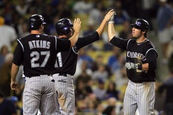 LOS ANGELES, CA - AUGUST 19:  Ian Stewart #24 of the Colorado Rockies celebrates his three-run eighth inning home run with teammates Brad Hawpe #11 and Garrett Atkins #27 during their MLB game against the Los Angeles Dodgers at Dodger Stadium on August 19