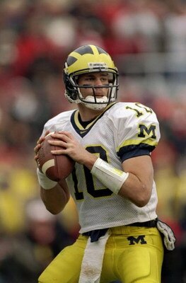 21 Nov 1998:  Quarterback Tom Brady #10 of the Michigan Wolverines in action during the game against the Ohio State Buckeyes at the Ohio Stadium in Columbus, Ohio. The Buckeyes defeated the Wolverines 31-16. Mandatory Credit: Rick Stewart  /Allsport