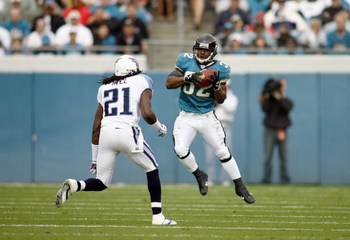 JACKSONVILLE, FL - NOVEMBER 05: Maurice Jones -Drew #32 of the Jacksonville Jaguars makes a catch during the game against Reynaldo Hill #21 of the Tennessee Titans on November 5, 2006 at Alltel Stadium in Jacksonville, Florida. (Photo by Marc Serota/Getty