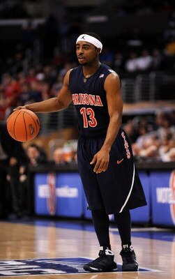 LOS ANGELES, CA - MARCH 12:  Guard Nic Wise #13 of the Arizona Wildcats looks to move the ball against the Arizona State Sun Devils during the Pacific Life Pac-10 Men's Basketball Tournament at the Staples Center on March 12, 2009 in Los Angeles, Californ