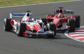 SUZUKA, JAPAN - OCTOBER 10: Rubens Barrichello of Brazil and Ferrari attempts to overtake Olivier Panis during the Japanese Grand Prix at Suzuka Circuit on October 10, 2004 in Suzuka, Japan.  (Photo by Clive Rose/Getty Images)