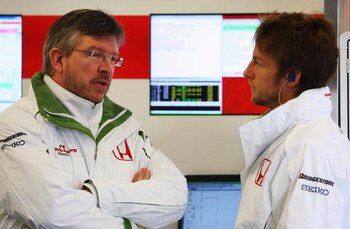 BARCELONA, SPAIN - NOVEMBER 19:  Jenson Button of Great Britain and team Honda chats to technical director Ross Brawn during day three of Formula One Testing at the Circuit de Catalunya on November 19, 2008 in Barcelona, Spain.  (Photo by Mark Thompson/Ge