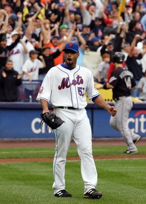NEW YORK - SEPTEMBER 27:  Johan Santana #57 of the New York Mets celebrates the final out of the game against the Florida Marlins on September 27, 2008 at Shea Stadium in the Flushing neighborhood of the Queens borough of New York City. The Mets defeated 