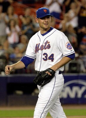 NEW YORK - JUNE 11:  Mike Pelfrey #34 of the New York Mets walks off the field after the eigth inning against the Arizona Diamonbacks on June 11, 2008 at Shea Stadium in the Flushing neighborhood of the Queens borough of New York City.  (Photo by Jim McIs