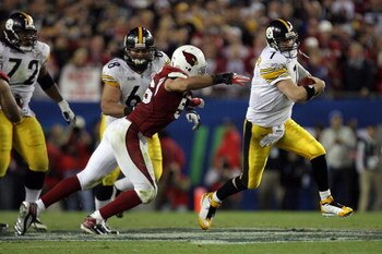 TAMPA, FL - FEBRUARY 01:  Quarterback Ben Roethlisberger #7 of the Pittsburgh Steelers avoids a sack by linebacker Chike Okeafor #56 of the Arizona Cardinals during Super Bowl XLIII on February 1, 2009 at Raymond James Stadium in Tampa, Florida.  (Photo b