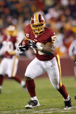 LANDOVER, MD - DECEMBER 21:  Marcus Washington #53 of the Washington Redskins carries the ball during the game of the Philadelphia Eagles on December 21, 2008 at FedEx Field in Landover, Maryland.  (Photo by Kevin C. Cox/Getty Images)