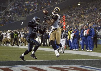 SEATTLE - NOVEMBER 13:  Marcus Trufant #23 of the Seattle Seahawks can't stop a touchdown pass to Torry Holt #81 of the St. Louis Rams during the game at Qwest Field on November 13, 2005 in Seattle, Washington.  The Seahawks won 31-16. (Photo by Otto Greu