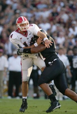 COLUMBIA, SC - SEPTEMBER 11:  Quarterback David Greene #14 of the Georgia Bulldogs gets hit after throwing a pass against the South Carolina Gamecocks during their game at Williams-Brice Stadium on September 11, 2004 in Columbia, South Carolina. Georgia d