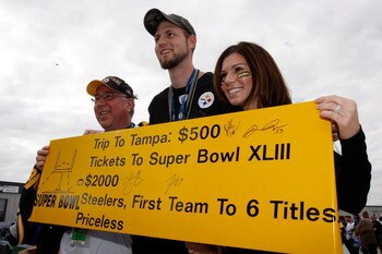 TAMPA, FL - FEBRUARY 01: (L-R) Tom Listwak, Justin Tomayko and Leslie Carey, fans of the Pittsburgh Steelers, hold up a 'priceless' sign in support of their trip to see the Steelers play against the Arizona Cardinals during Super Bowl XLIII on February 1,