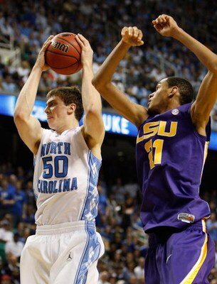 GREENSBORO, NC - MARCH 21:  Tyler Hansbrough #50 of the North Carolina Tar Heels grabs a rebound against Chris Johnson #21 of the Louisiana State University Tigers during the second round of the NCAA Division I Men's Basketball Tournament at the Greensbor