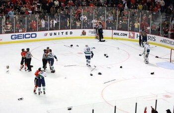 CHICAGO - MARCH 29: Referees attempt to break up several fights between the Chicago Blackhawks and the Vancouver Canucks in the third period on March 29, 2009 at the United Center in Chicago, Illinois. The Canucks defeated the Blackhawks 4-0. (Photo by Jo