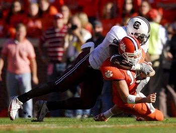 CLEMSON, SC - NOVEMBER 25:  Jasper Brinkley #52 of the South Carolina Gamecocks sacks quarterback Will Proctor #14 of the Clemson Tigers during an NCAA football game at Memorial Stadium November 25, 2006 in Clemson, South Carolina. South Carolina won 31-2