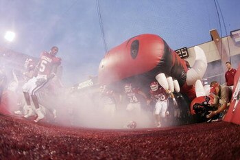 FAYETTEVILLE, AR - SEPTEMBER 2:  Players of the Arkansas Razorbacks take the field before the game against the University of Southern California Trojans on September 2, 2006 at Donald W. Reynolds Razorback Stadium in Fayetteville, Arkansas.  Southern Cali