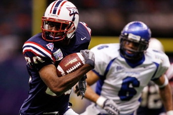 NEW ORLEANS - DECEMBER 21:  Lester Jean #80 of the Florida Atlantic University Owls avoids a tackle by Dontae Reed #6 of the Memphis University Tigers  in the New Orleans Bowl on December 21, 2007 at the Louisiana Superdome in New Orleans, Louisiana.  The