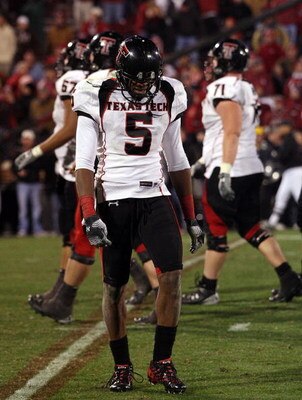 NORMAN, OK - NOVEMBER 22:  Wide receiver Michael Crabtree #5 of the Texas Tech Red Raiders walks off the field at the end of a 65-21 loss against the Oklahoma Sooners at Memorial Stadium on November 22, 2008 in Norman, Oklahoma.  (Photo by Ronald Martinez