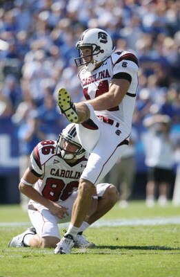LEXINGTON, KY - OCTOBER 11:  Punter Ryan Succop #14 of the South Carolina Gamecocks kicks as teammate Stephen Flint #86 looks on against the Kentucky Wildcats during the game at Commonwealth Stadium on October 11, 2008 in Lexington, Kentucky. South Caroli