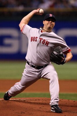 ST PETERSBURG, FL - OCTOBER 18:  Starting pitcher Josh Beckett #19 of the Boston Red Sox delivers a pitch against the Tampa Bay Rays in game six of the American League Championship Series during the 2008 MLB playoffs on October 18, 2008 at Tropicana Field