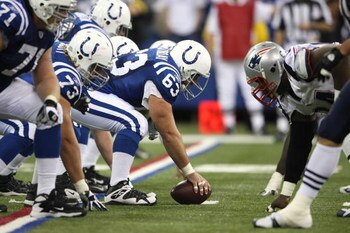 INDIANAPOLIS - NOVEMBER 04:  Offensive center Jeff Saturday #63 of the Indianapolis Colts readies the ball for the snap against the New England Patriots on November 4, 2007 at the RCA Dome in Indianapolis, Indiana. The Patriots won 24-20. (Photo by Andy L