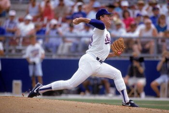 ARLINGTON, TX - 1990s:  Nolan Ryan #34 of the Texas Rangers pitches during a circa 1990s game at Arlington Stadium in Arlington, Texas. Ryan pitched for the Rangers from 1989-93.  (Photo by Jonathan Daniel/Getty Images)