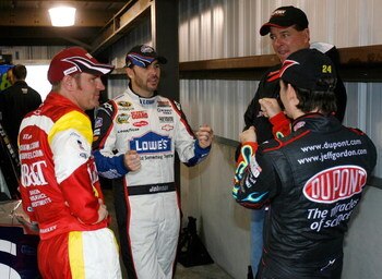 MARTINSVILLE, VA - MARCH 28: Clint Bowyer (L), driver of the #33 BB&T Chevrolet, talks with Jimmie Johnson (C), driver of the #48 Lowe's Chevrolet, Jeff Gordon (R), driver of the #24 DuPont Chevrolet, and Ron Hornaday, Jr., driver of the Camping World Tru
