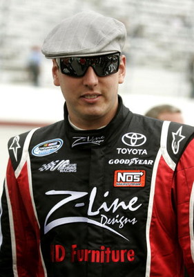 BRISTOL, TN - MARCH 21: Kyle Busch, driver of the #18 Z-Line Designs Toyota, stands on pit road the NASCAR Nationwide Series Scotts Turf Builder 300 at Bristol Motor Speedway on March 21, 2009 in Bristol, Tennessee. (Photo by Jerry Markland/Getty Images