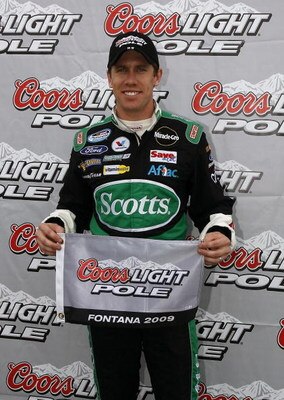 FONTANA, CA - FEBRUARY 21:  Carl Edwards, driver of the #60 Scotts Ford, poses after winning the pole position for the NASCAR Nationwide Series Stater Bros. 300 at Auto Club Speedway on February 21, 2009 in Fontana, California.  (Photo by Jason Smith/Gett