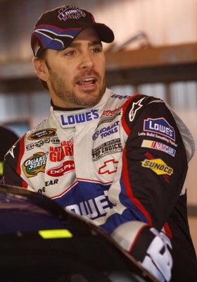 MARTINSVILLE, VA - MARCH 28: Jimmie Johnson, driver of the #48 Lowe's Chevrolet, climbs out of his car during practice for the NASCAR Sprint Cup Series Goody's Fast Pain Relief 500 at the Martinsville Speedway on March 28, 2009 in Martinsville, Virginia. 