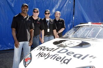 DAYTONA BEACH, FL - FEBRUARY 13: (L-R) Evander Holyfield, Floyd Ganassi, Kenny Hendrick and Eddie Smith pose prior to practice for the NASCAR Sprint Cup Series Daytona 500 at Daytona International Speedway on February 13, 2009 in Daytona Beach, Florida.  