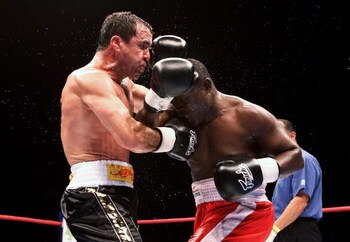 MELBOURNE, AUSTRALIA - JUNE 24:  Jeff Fenech (L) and Azumah Nelson exchanges blows during their welterweight fight at the Vodafone Arena on June 24, 2008 in Melbourne, Australia.  (Photo by Quinn Rooney/Getty Images)