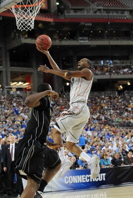 GLENDALE, AZ - MARCH 26:  Guard A.J. Price #12 of the Connenticut Huskies drives to the hoop against the Purdue Boilermakers in the Sweet 16 of the NCAA Division I Men's Basketball Tournament at the University of Phoenix Stadium on March 26, 2009 in Glend