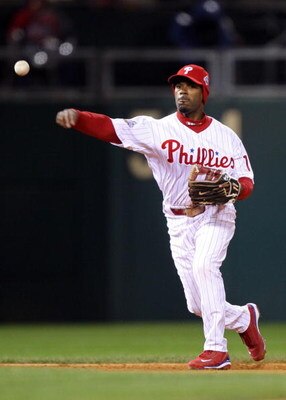 PHILADELPHIA - OCTOBER 27:  Jimmy Rollins #11 of the Philadelphia Phillies throws the ball to first to force out Jason Bartlett #8 of the Tampa Bay Rays during the top of the third inning of game five of the 2008 MLB World Series on October 27, 2008 at Ci